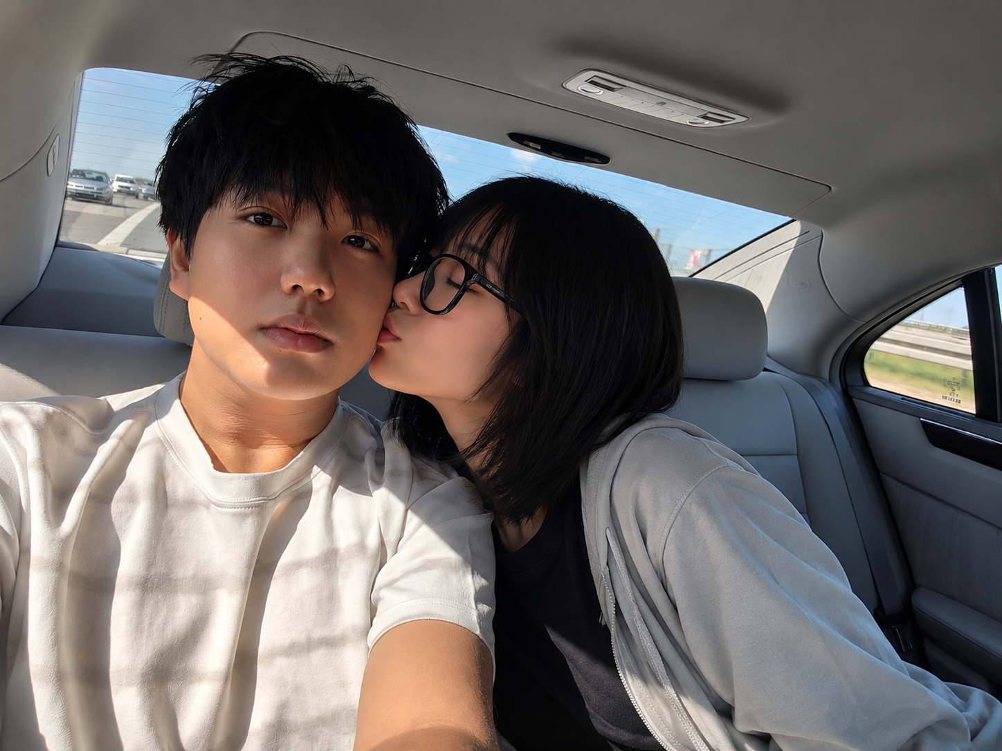 A candid moment together in the car